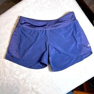 Lululemon Athletica Speed Shorts Purple Mesh lined Zipper Back pocket Size 4